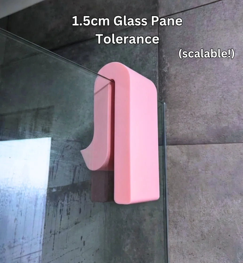 Phone shower amplifier clipped on glass pane showing 1.5cm tolerance